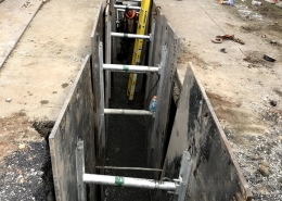 Drywell sump roadway project underway by Duke Construction excavation equipment