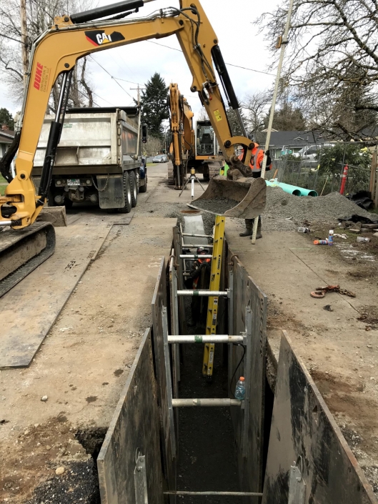 Drywell sump roadway project underway by Duke Construction excavation equipment