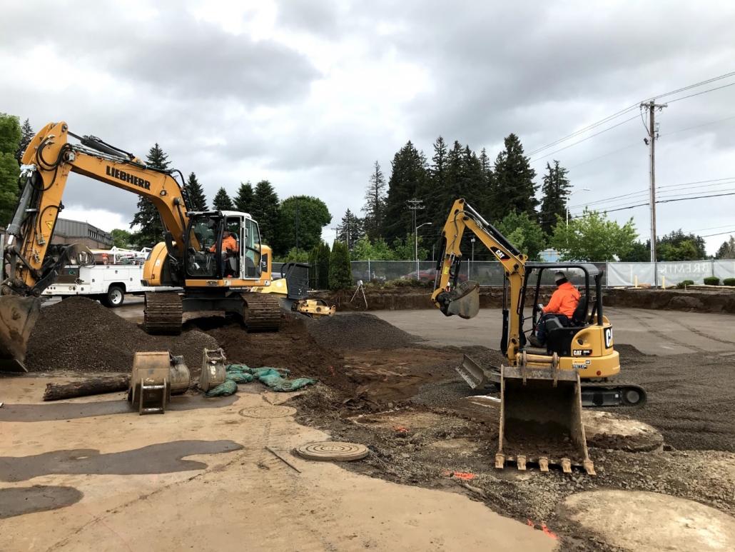 Tualatin Service Center excavation project in progress installing commercial sanitary line and concrete slab foundation for office building
