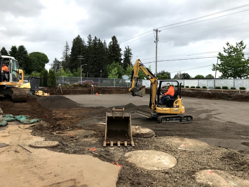 Tualatin Service Center excavation project in progress installing commercial sanitary line and concrete slab foundation for office building