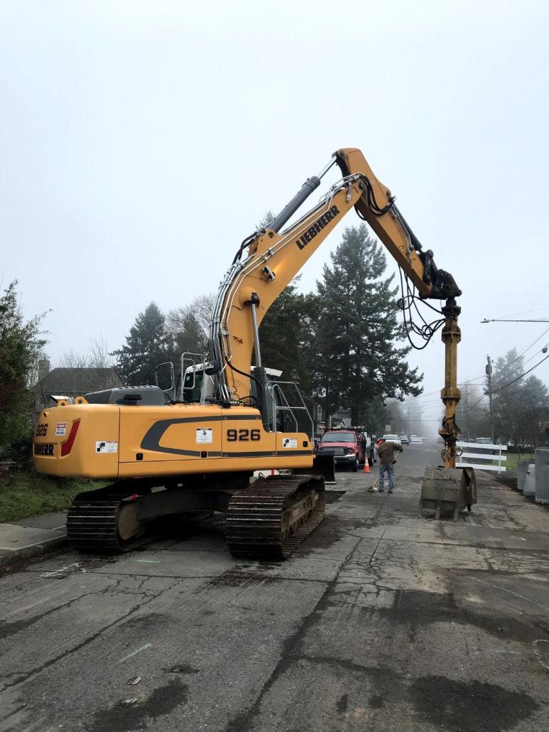 Drywell sump roadway project underway by Duke Construction excavation equipment